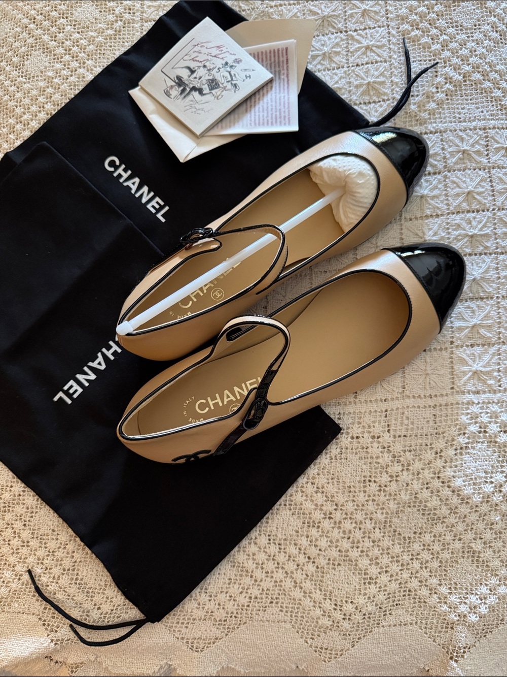 CHANEL Beige and Black Mary Jane Cap-Toe Flats never worn in original box.